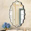 Miroir mural élégant et ovale ondulé-107728798-107728797