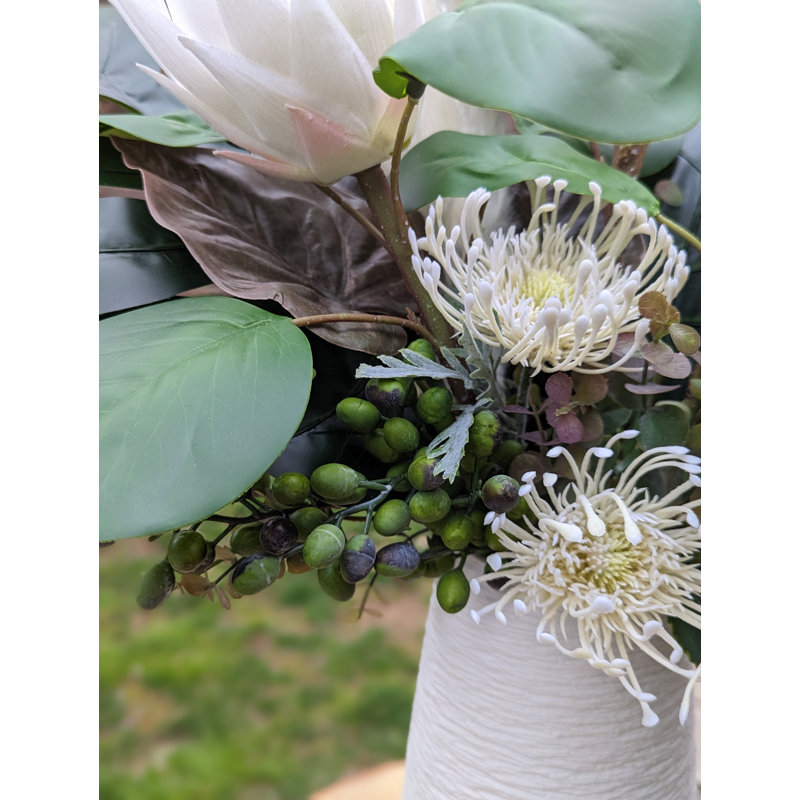 Arrangement floral varié Protea dans un vase