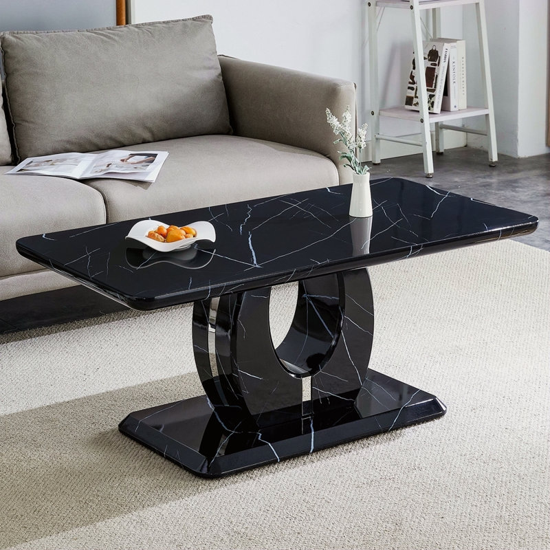 La table basse rectangulaire moderne et minimaliste à motif de panneaux de fibres à densité moyenne ajoute une atmosphère paisible et confortable à votre maison