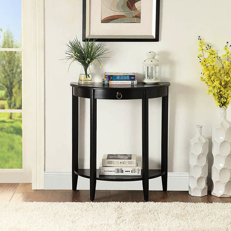 La console demi-lune noire est idéale pour le rangement et la décoration.