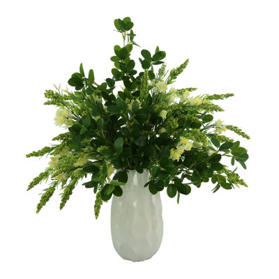 Budding Hydrangeas and Boxwoods Arranged in a Ceramic Vase
