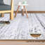 Tapis rectangulaire gris en fausse fourrure tressé à la machine Jodyann-86785139