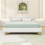 Grand lit plateforme tapissier Teddy, design minimaliste courbé