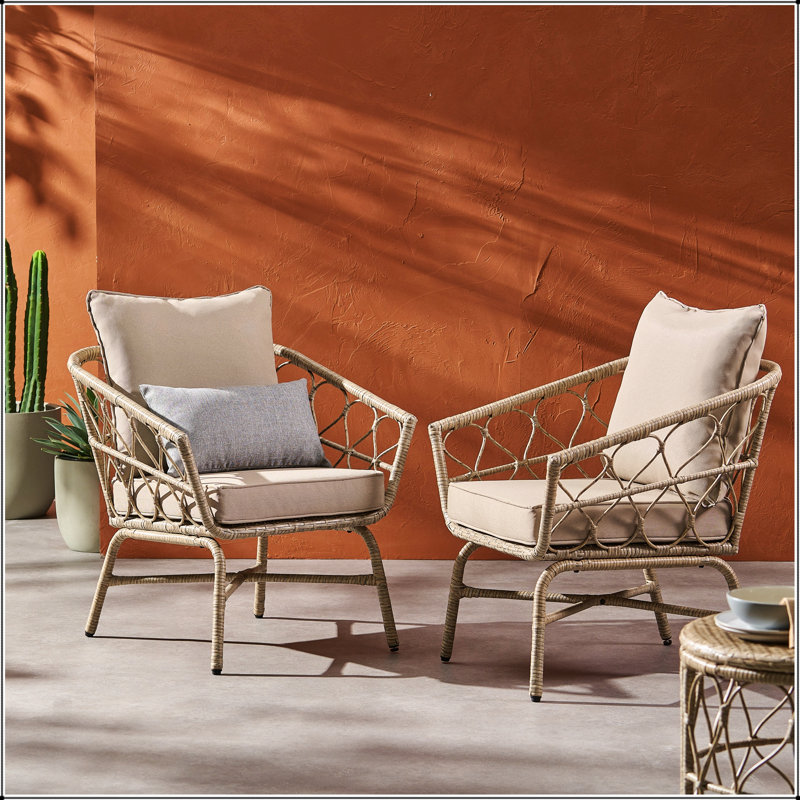 Fauteuil club d'extérieur en rotin tissé BRUCE BOHO-INSPIRED avec coussins résistants à l'eau et rotin en polyéthylène durable