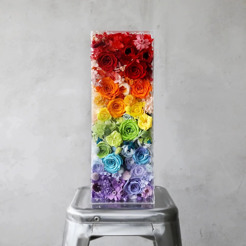 Arrangement floral arc-en-ciel rose