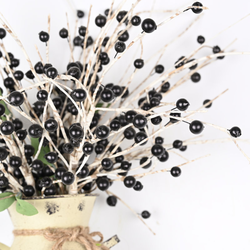 Arrangement floral de fausses baies en pot
