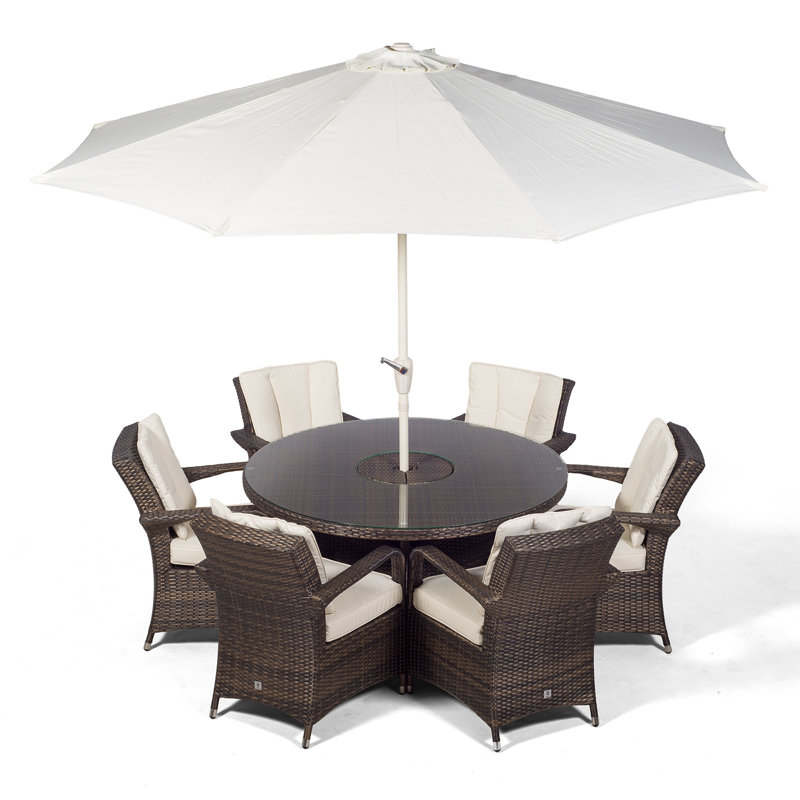 Karas 6 - Person Wicker Patio Dining Set with Round Table , Cushions Included, Brown