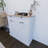 White Kitchen Trash Can Storage Cabinet With 2 Drawers And 1 Tilting Trash Cabinet And 1 Door With Storage Rack And 2 Shelves