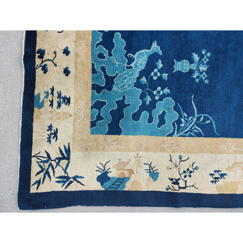 Tapis antique chinois à motif floral sur fond bleu