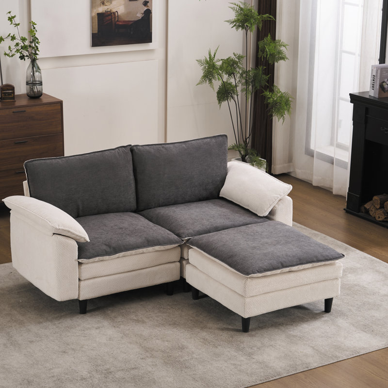 Canapé modulaire réversible en tissu chenille avec repose-pieds flottant et accoudoirs coussinés