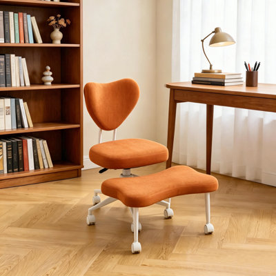 Ce fauteuil de méditation est un fauteuil ergonomique à pieds croisés avec soutien lombaire et un coussin de siège réglable en hauteur, idéal pour les personnes qui font un travail de bureau à haute intensité. Orange