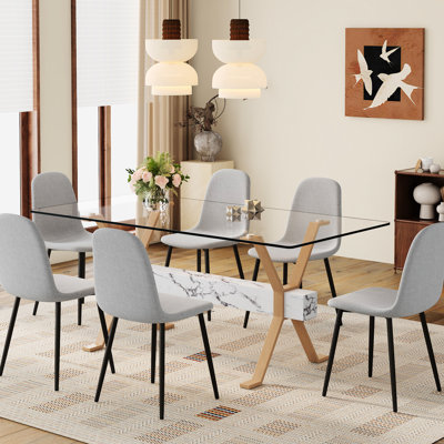 Table en verre transparent de 71 po x 35,4 po et 6 chaises en lin gris, confortable pour les réunions de famille avec un tissu simple et élégant