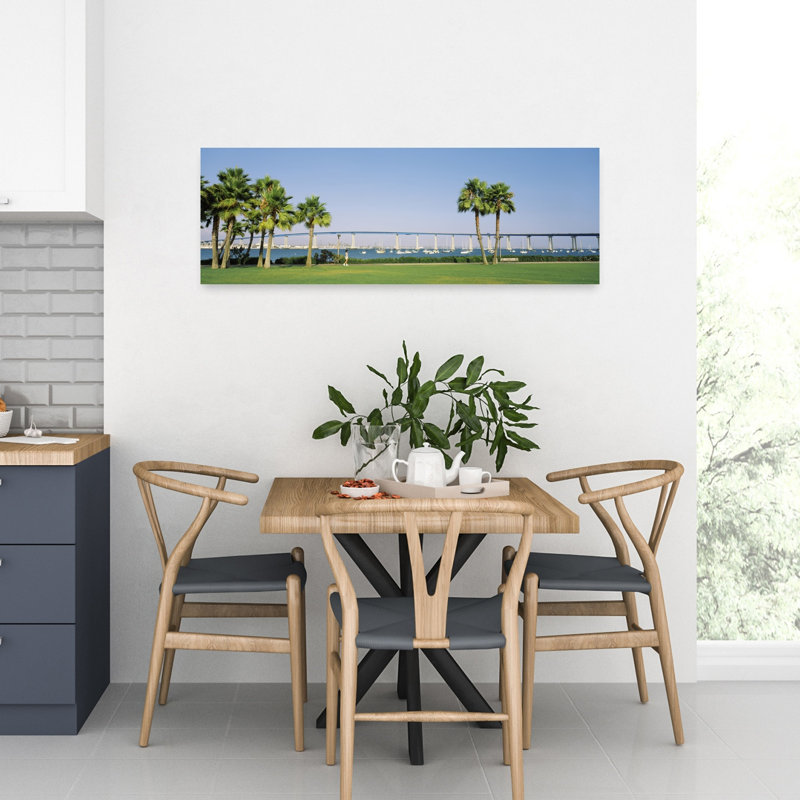 Palm Trees On The Coast With Bridge In The Background Coronado Bay Bridge San Diego San Diego County California USA by Morey K Milbradt - Wrapped Canvas Panoramic Print
