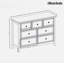 Commode moderne avec 7 tiroirs, poignées en métal et surface en grain de bois