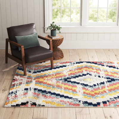 Tapis géométrique ivoire / orange / bleu Finis