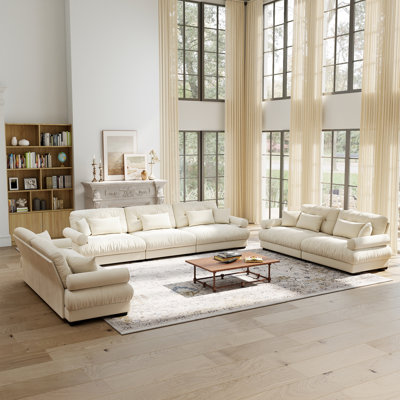 A luxury modular sofa set, including 1 three-seater + 2 two-seaters, crafted from off-white velvet fabric, complete with throw pillows and lumbar pill