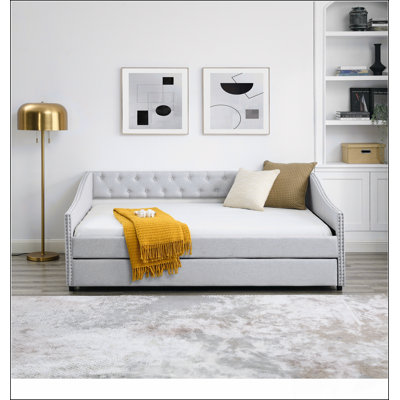 Mid-Century Inspired Tufted Daybed With Trundle, Copper Nailhead Trim, And Waved Arms For Comfort And Style