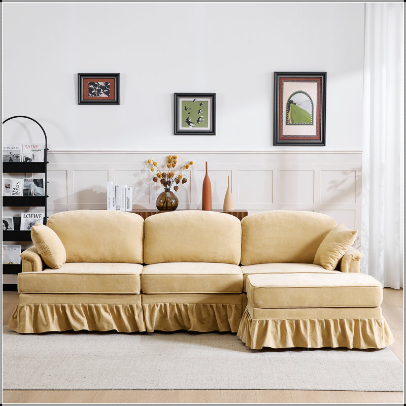 Canapé d'angle moderne en chenille d'une forme en L avec jupe à volants amovible et pouf pour un confort optimal dans votre salon