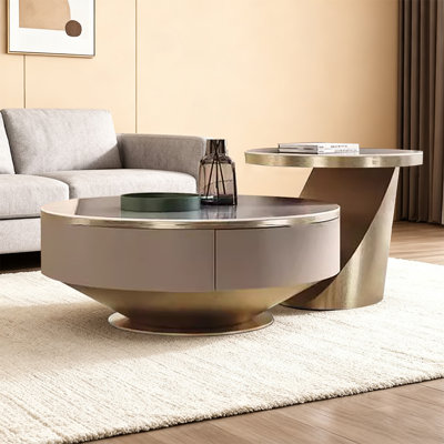 Table basse moderne et simple à plaque de pierre avec une combinaison circulaire et un design créatif de tiroir pour la table basse du salon