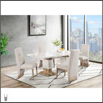 Ensemble de table de salle à manger élégant en faux marbre avec chaises confortables, parfait pour les espaces modernes et compacts