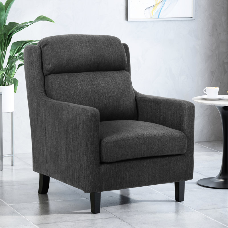 Élégant fauteuil club gris anthracite avec revêtement doux et base avec des pieds robustes et robustes à dossier en cascade