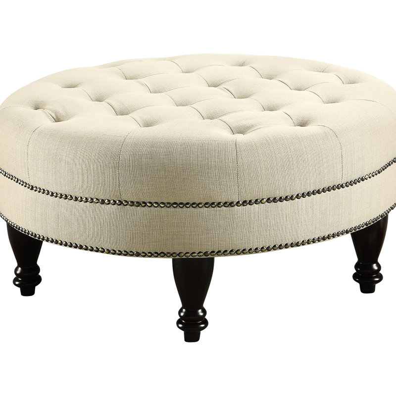 Gruau invitant avec capitonnage moderne et pattes brun foncé