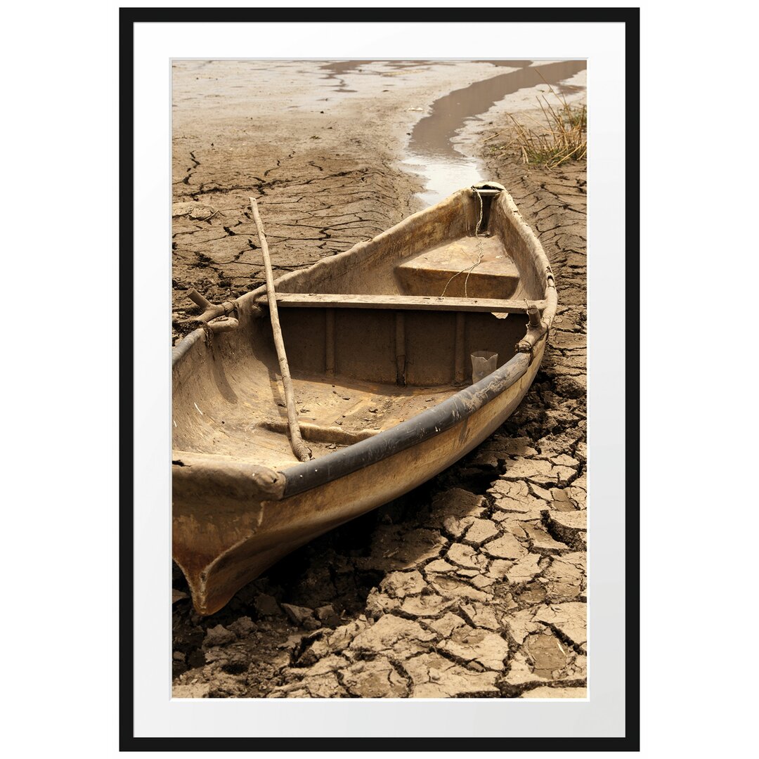 Gerahmter Fotodruck Boat in a Dried-Up Lake