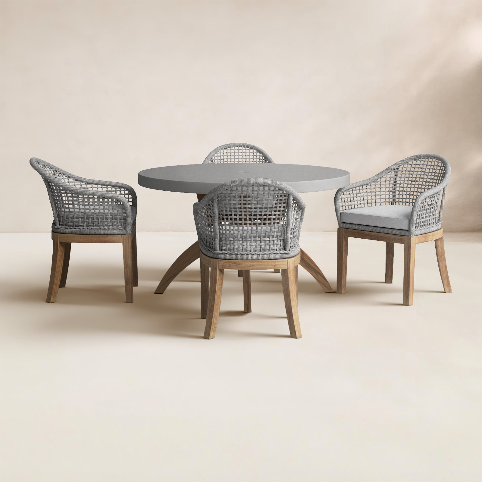 Akiva 52'' Round 4 - Person Outdoor Dining Set with Sunbrella Cushions