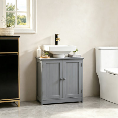 Le meuble-lavabo bleu en forme de U est compatible avec les lavabos muraux à piédestal. Fabriqué en panneau de fibres à densité moyenne, il dispose de tablettes réglables, de portes doubles, d'un grand espace de rangement et d'une capacité de poids totale de 33 livres.