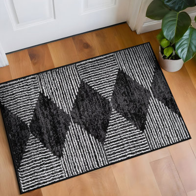 Tapis noir à rayures géométriques ivoire