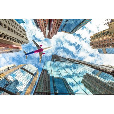 " Airplane Flying Over Skyscrapers "