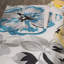 Tapis performance crème / jaune / bleu à motif floral moderne-29433633