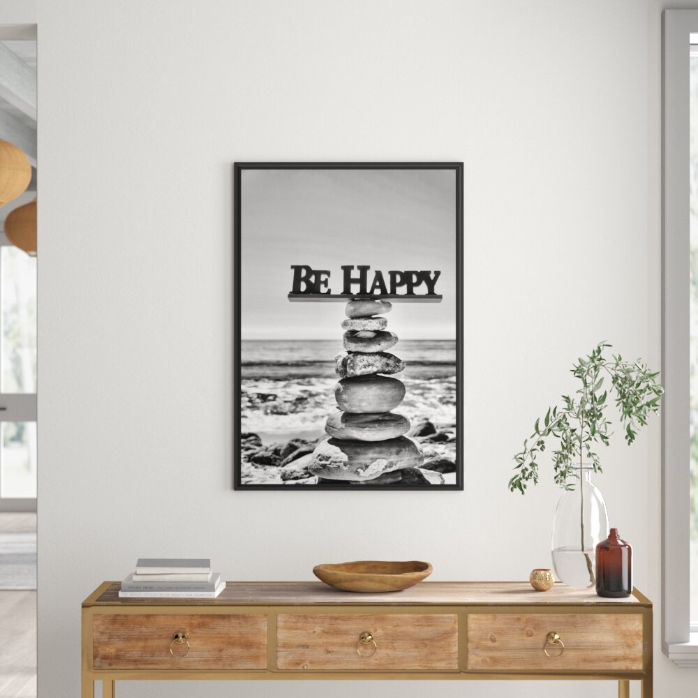 Gerahmtes Wandbild Steinturm am Strand