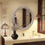 Miroir mural rond avec cadre sculpté