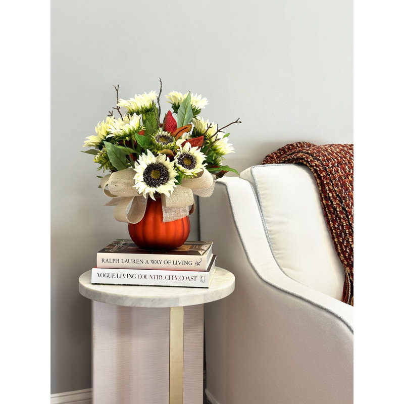 Fall Arrangement with Sunflowers and Magnolia Leaves in Pumpkin Vase