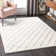 Tapis crème / rosé à motif géométrique Roussel