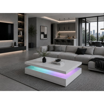 Table basse 47,2 "Delphi avec chargement sans fil, haut-parleur Bluetooth, éclairage à DEL RVB, tiroir de rangement et finition blanche moderne Delphi