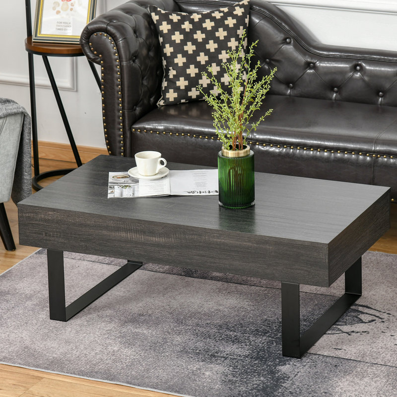Table gris foncé avec tiroir de rangement agencé de façon créative