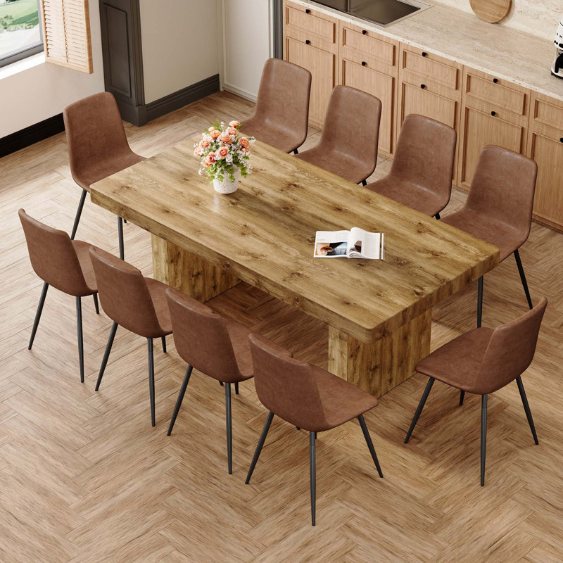 Ensemble de table et de chaises. Table de salle à manger en grain de bois MDF, jumelée à des chaises en tissu avec pieds en métal