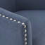 Fauteuil pivotant bleu, avec un élégant clou argenté et un rembourrage en mousse à base noire en métal