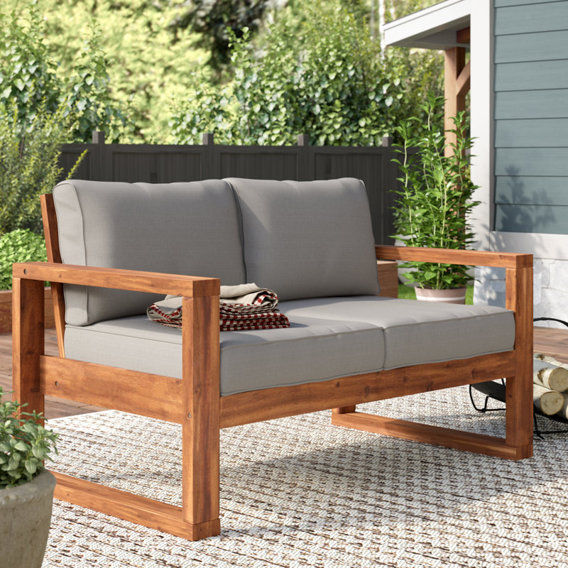 Causeuse d'extérieur en bois d'acacia avec coussins