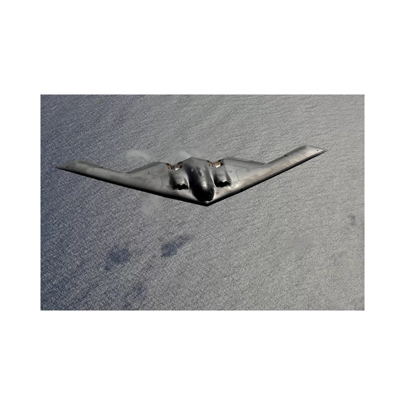A B-2 Spirit Flies Over The Pacific Ocean - Wrapped Canvas Print, 30.48 cm H x 45.72 cm W