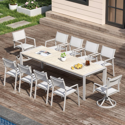 Ensemble de salle à manger d'extérieur extensible 11 pièces pour 10 personnes, comprenant 2 chaises pivotantes, une table extensible avec plateau en imitation bois et des chaises empilables en textilène pour terrasse ou jardin.