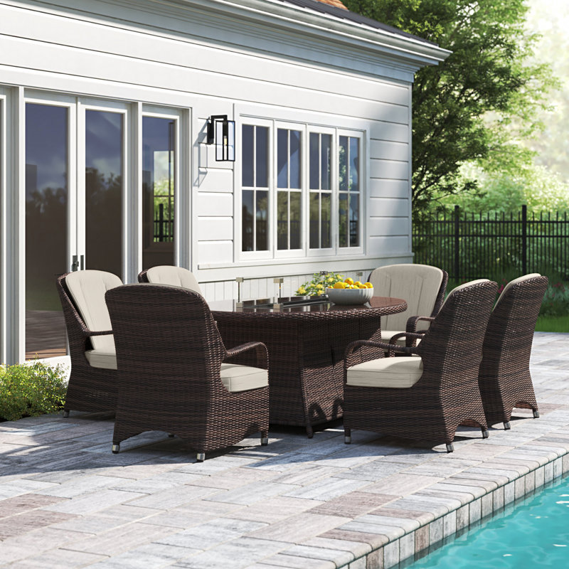 Algird 6 - Person Wicker Patio Dining Set with Oval Table , Cushions Included