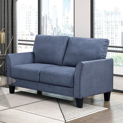 Bleu rembourré avec structure en bois massif et ressorts ensachés noirs apparents de style contemporain avec rembourrage en mousse haute densité