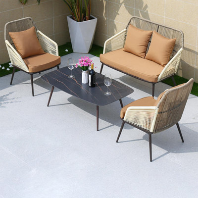 Noorin Wicker 4 - Person Patio Conversation Set with Cushions