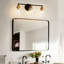 Luminaire de meuble-lavabo moderne à 3 lumières noir et bronze avec abat-jour en verre transparent
