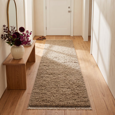 Tapis à poil long en laine de couleur unie tissé à la main en brun