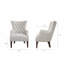 Fauteuil à oreilles capitonné