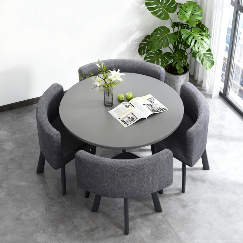 Ensemble de salle à manger rond compact gris avec quatre chaises - Design moderne pour petits espaces
